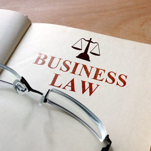 A business law book with glasses